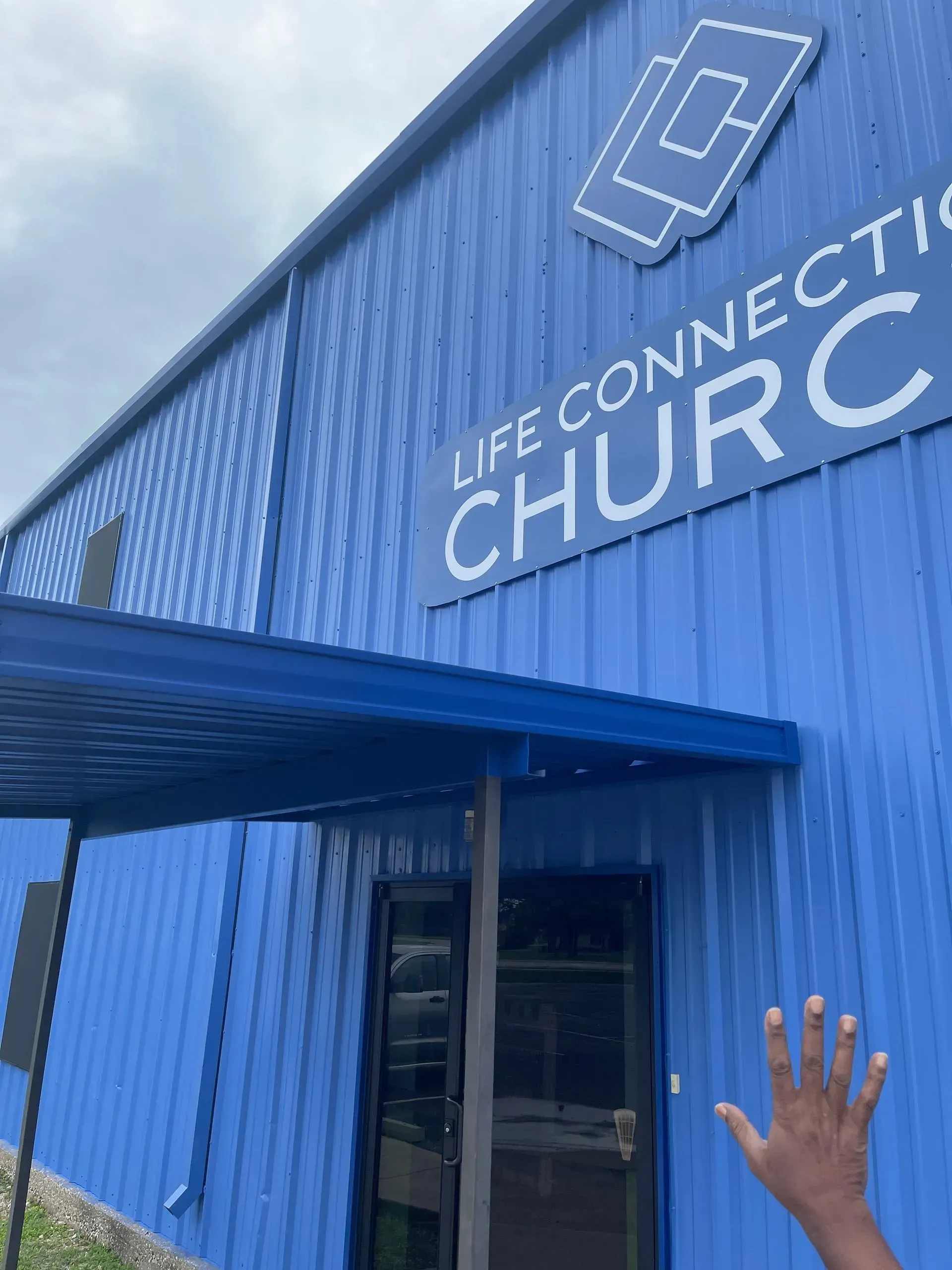 A blue building with the word church on it