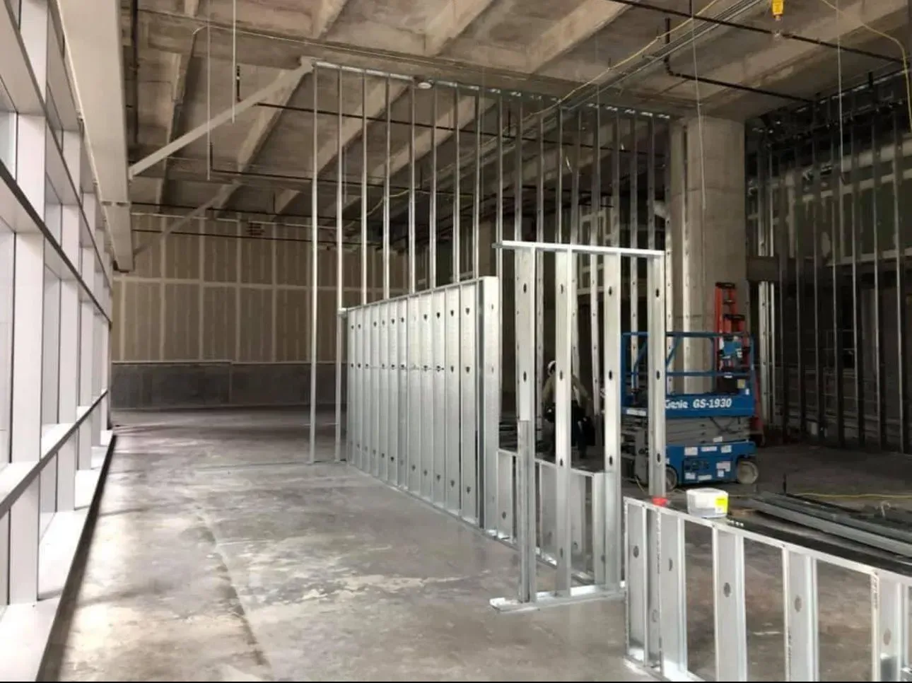 A large room with a lot of windows and metal walls.