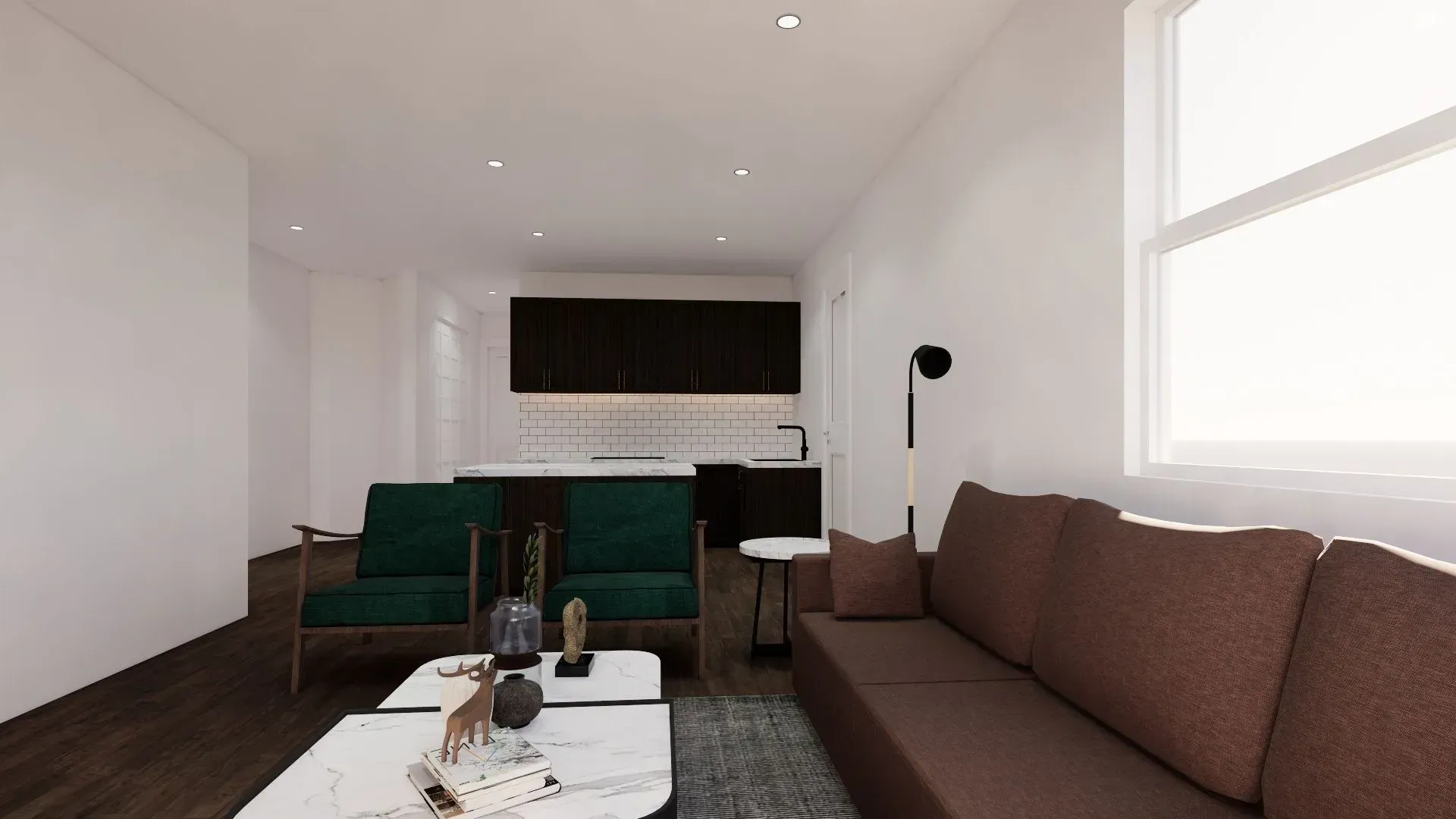 A living room with a couch , two chairs , a coffee table and a window.