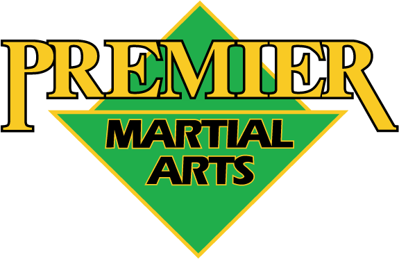 a green and yellow logo for premier martial arts