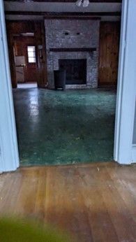 There is a fireplace in the middle of the room.