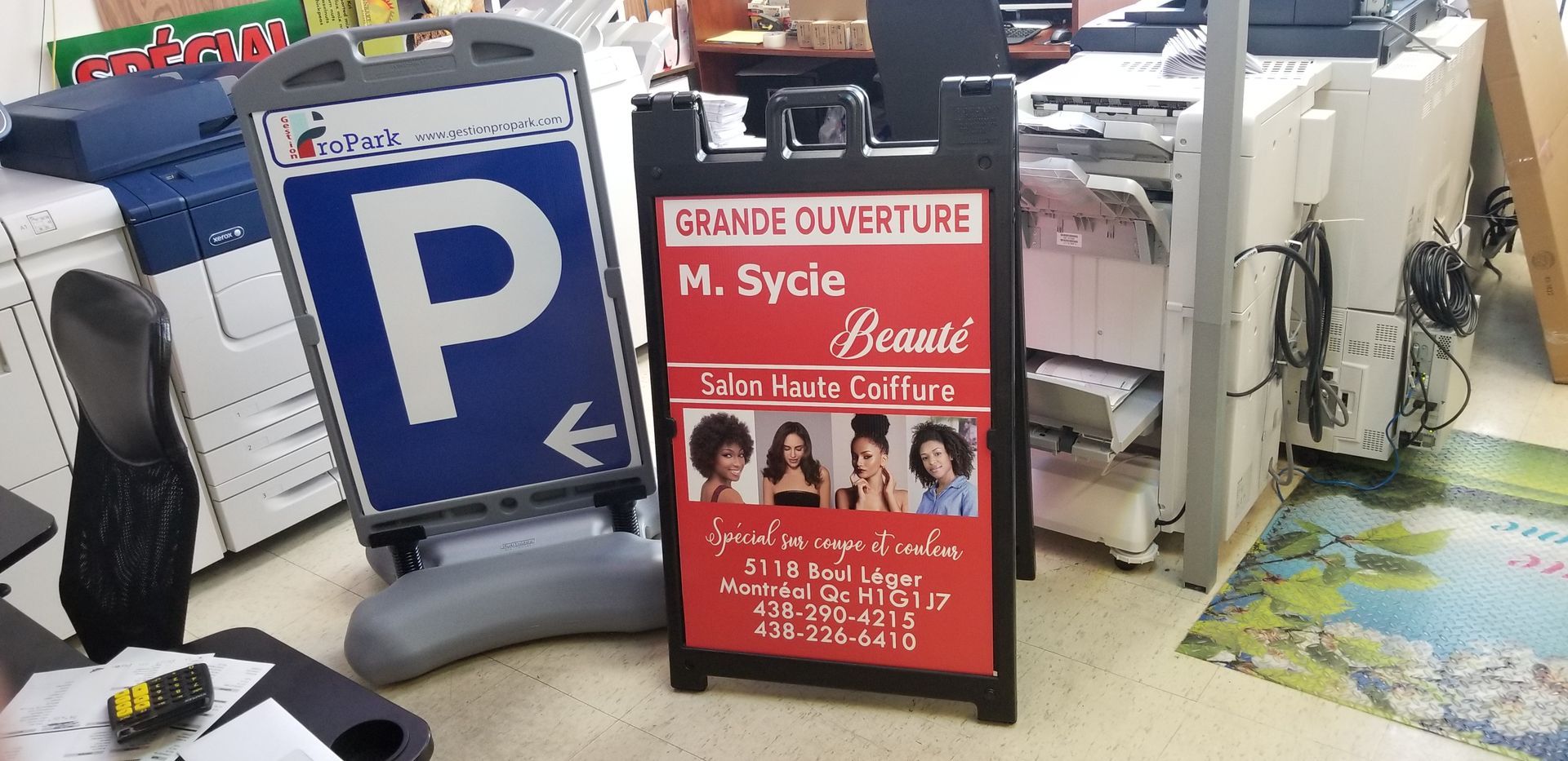 Parking sign and an A-frame sign promoting