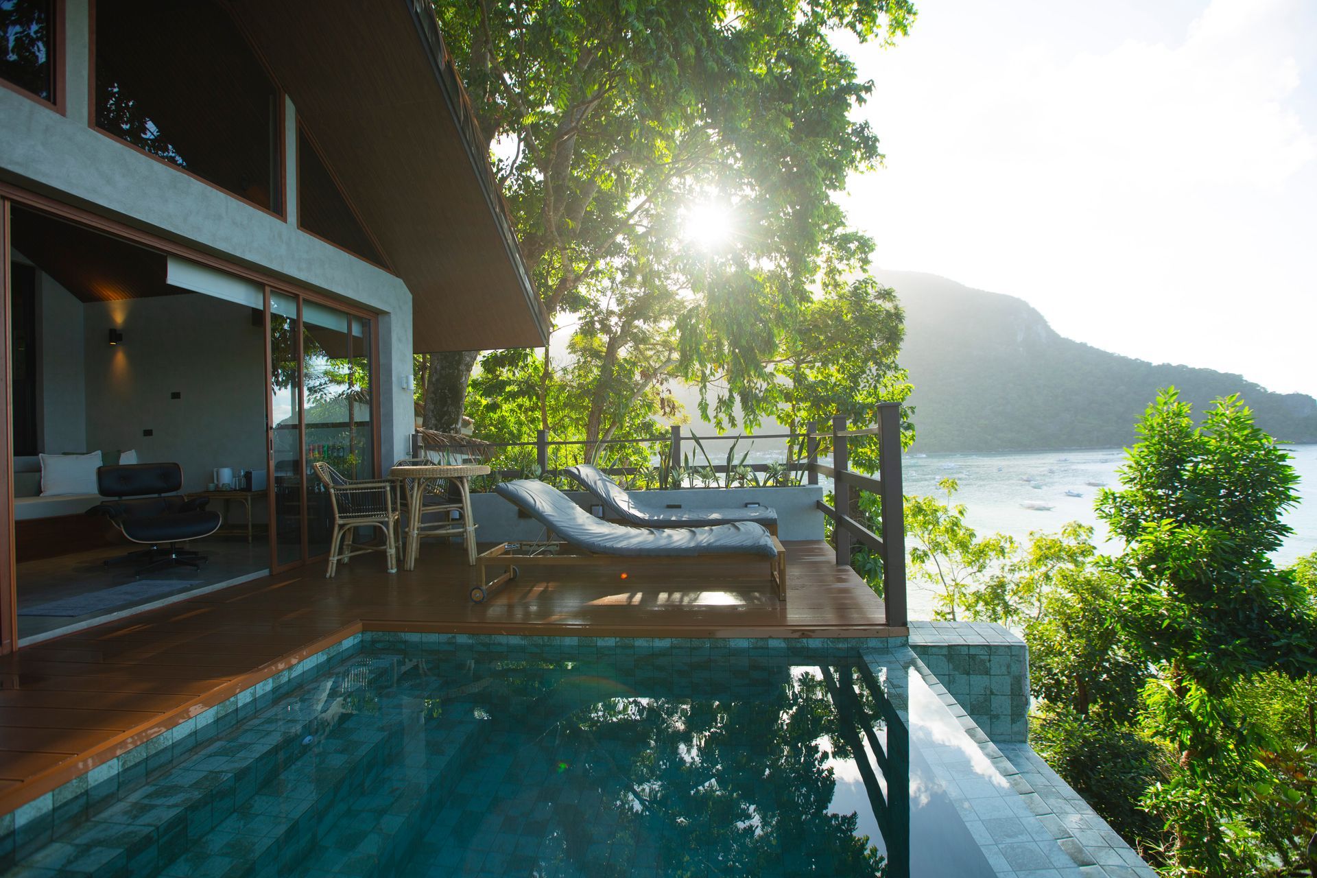 A house with a swimming pool and a view of the ocean
