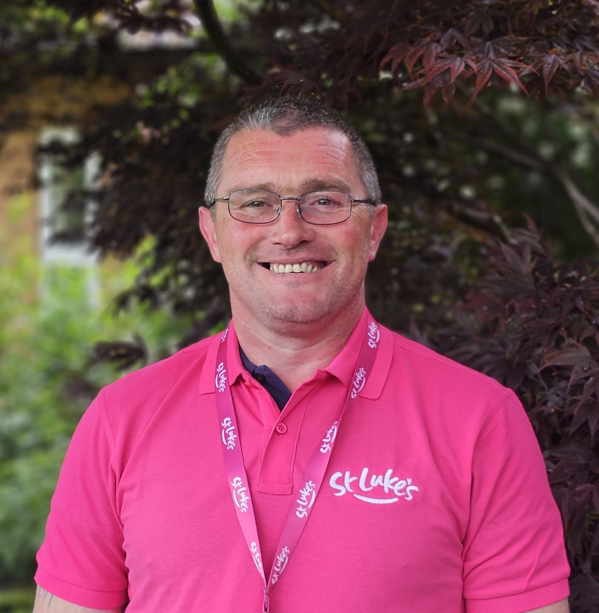 Man in pink shirt with