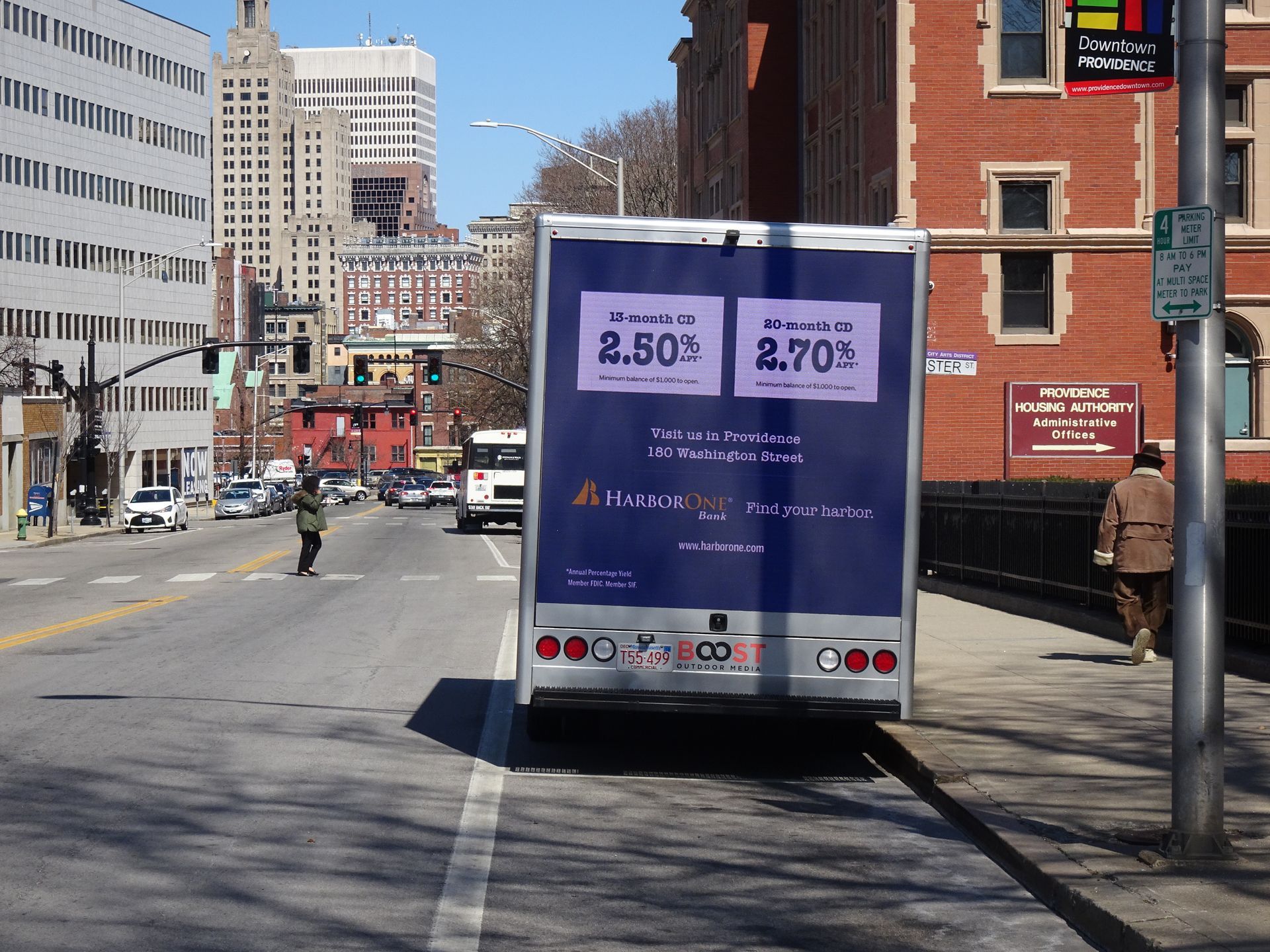 Mobile digital billboard displaying a vibrant bank advertisement on a busy city street and Innovative mobile billboard advertising various banking services, driving through an urban area