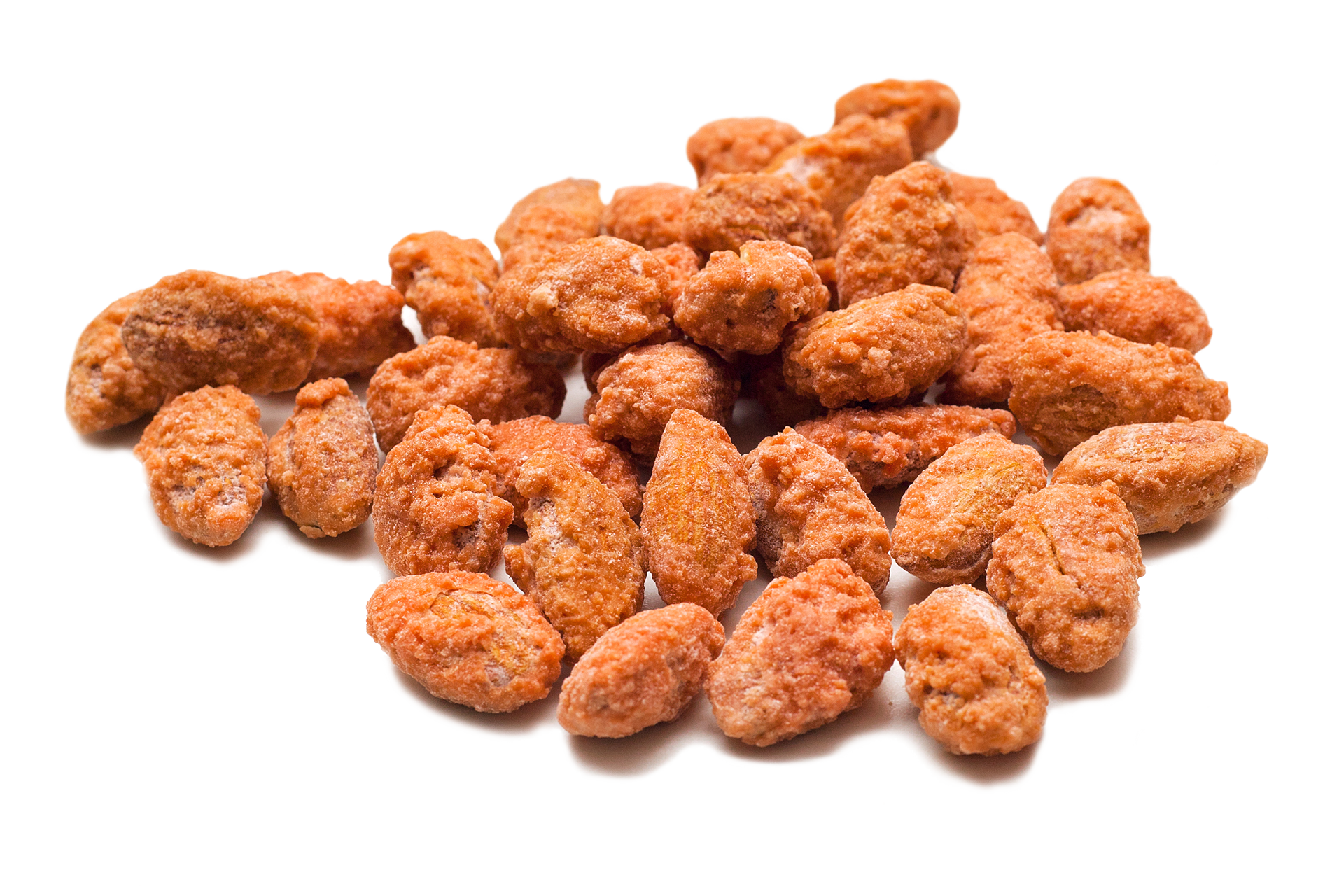 A pile of fried almonds on a white background