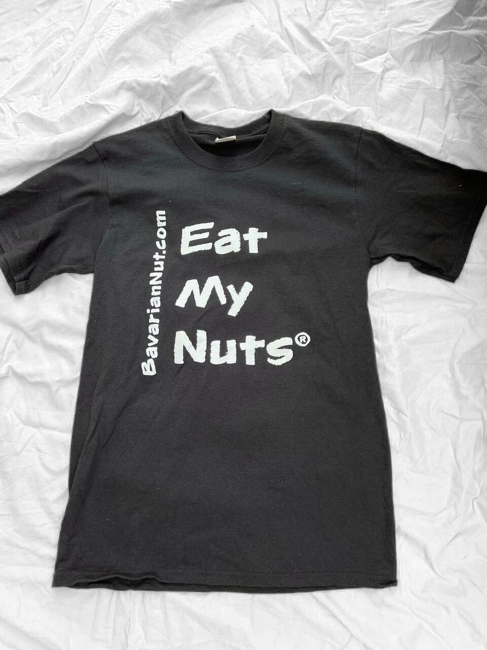 wearing black t-shirt with Eat My Nuts print