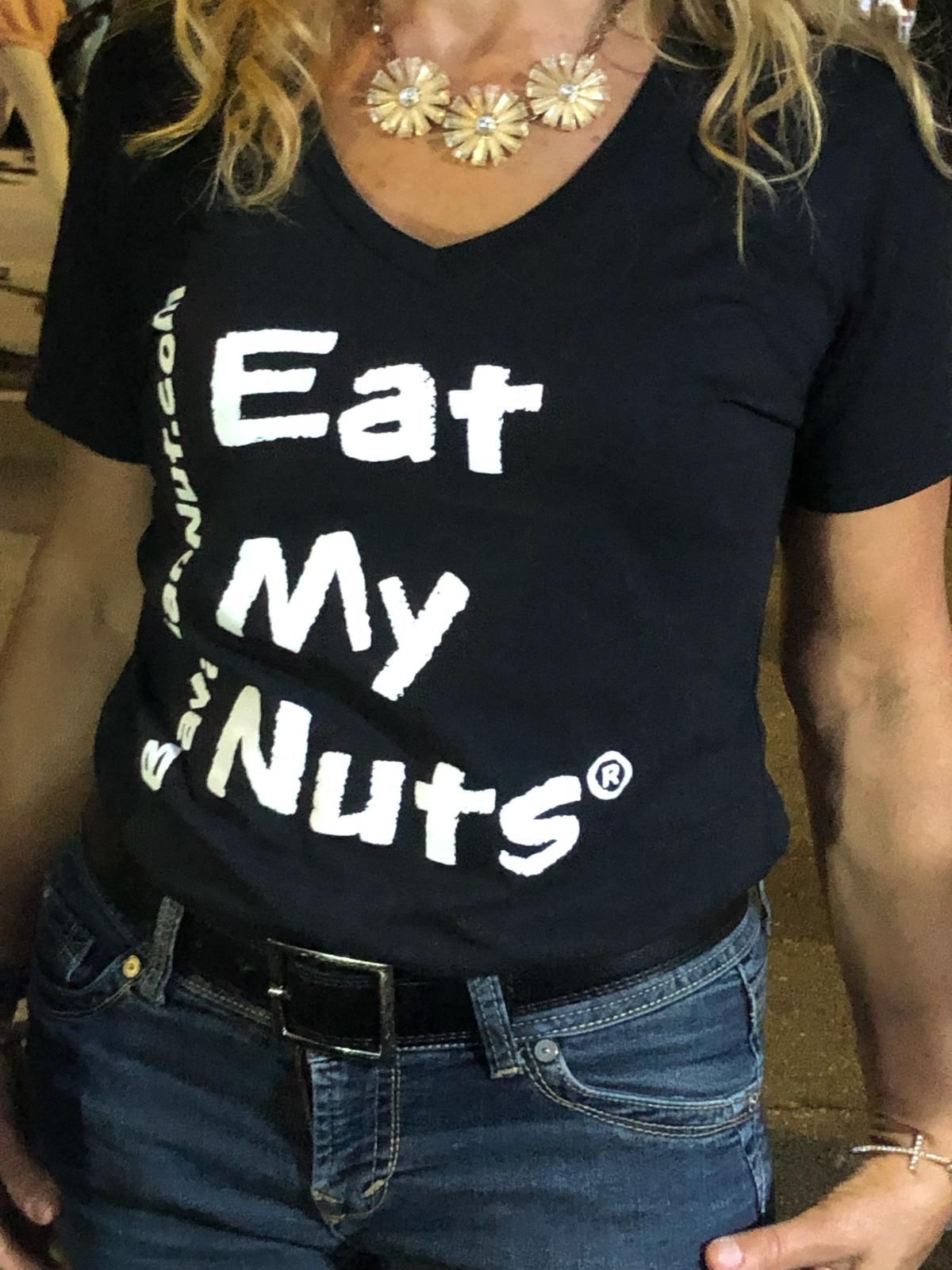 Woman wearing black t-shirt with Eat My Nuts print