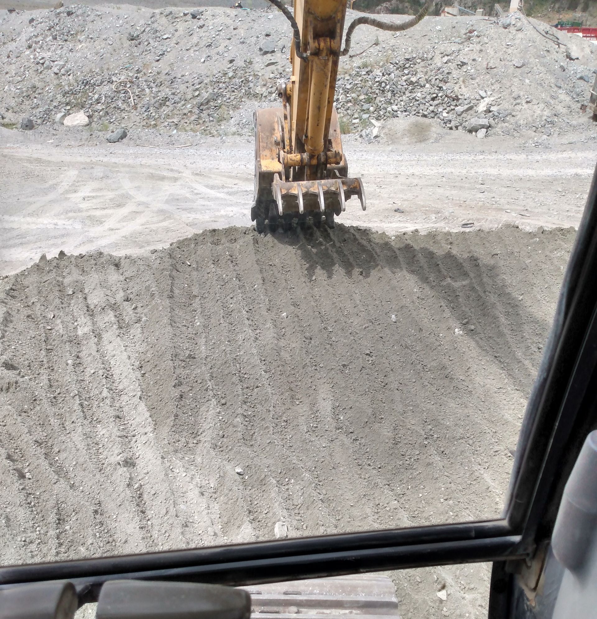 An excavator is moving dirt on a construction site