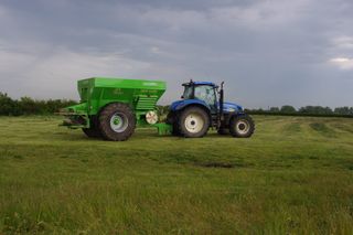 tractor towing a hopper
