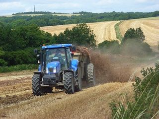 tractor ploughinmg a field