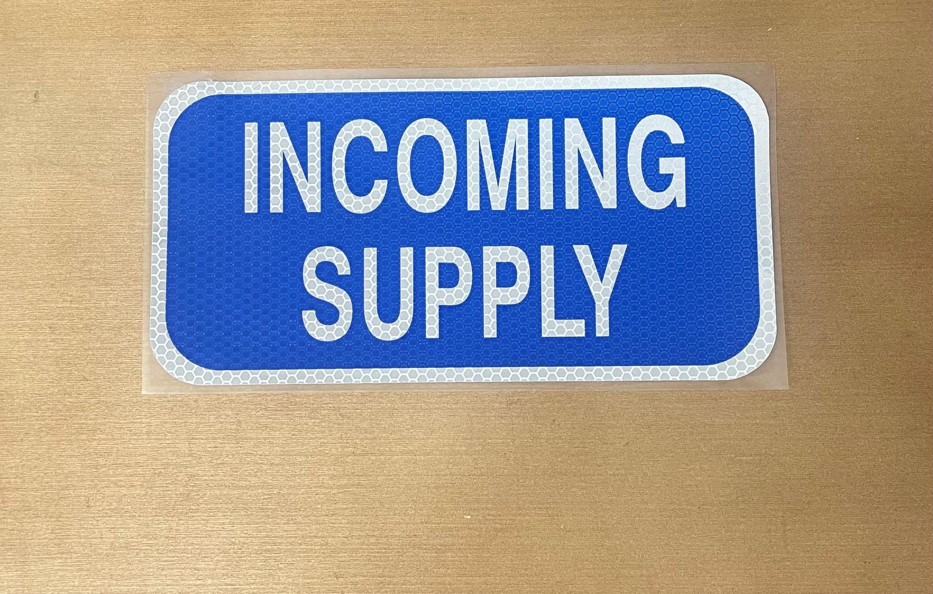 A blue sign that says incoming supply on it — Brookes Engraving & Signs in Woonona, NSW
