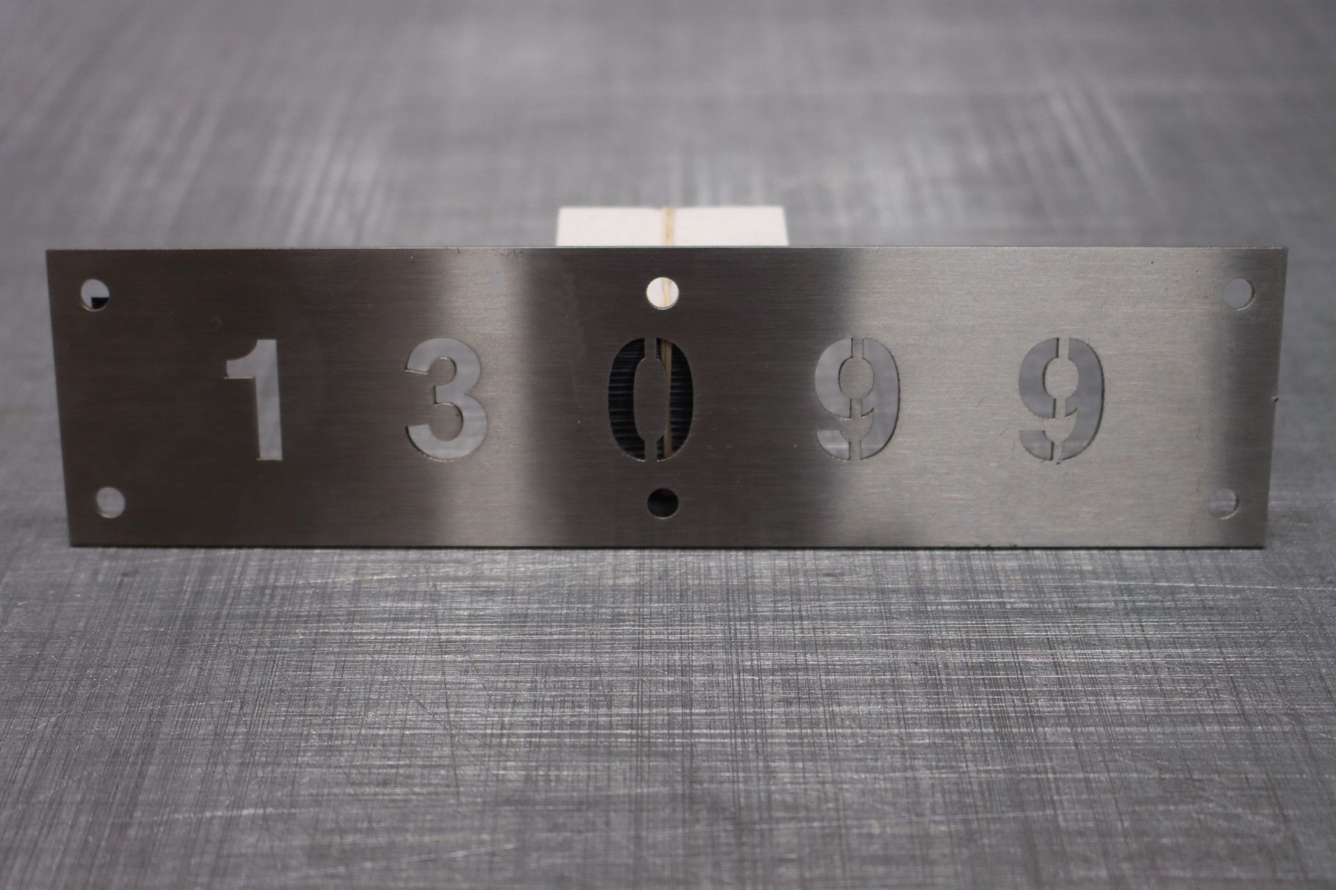 A stainless steel sign with the numbers 1 3 and 9 on it — Brookes Engraving & Signs in Woonona, NSW