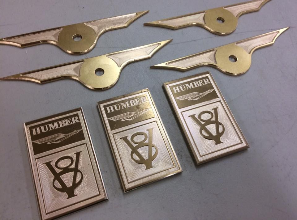 Engraving on brass car badges