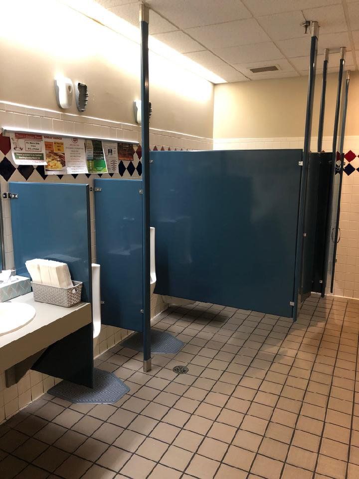 Blue bathroom stalls and doors.