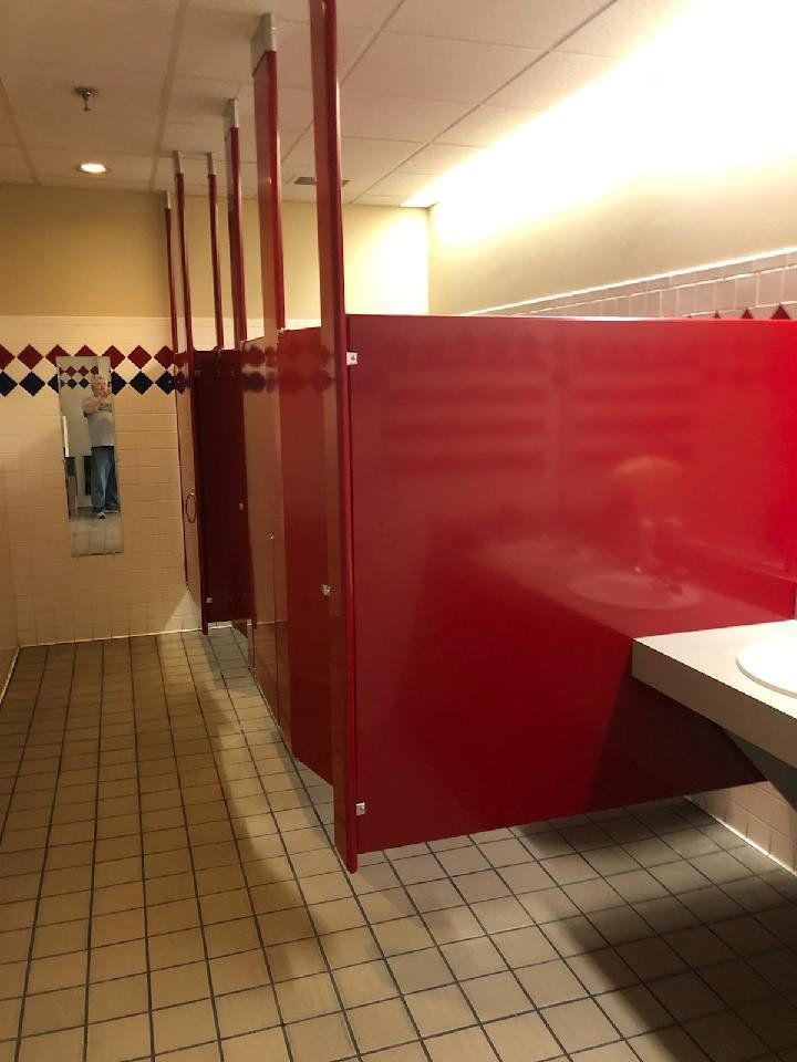 Red bathroom stalls and doors.
