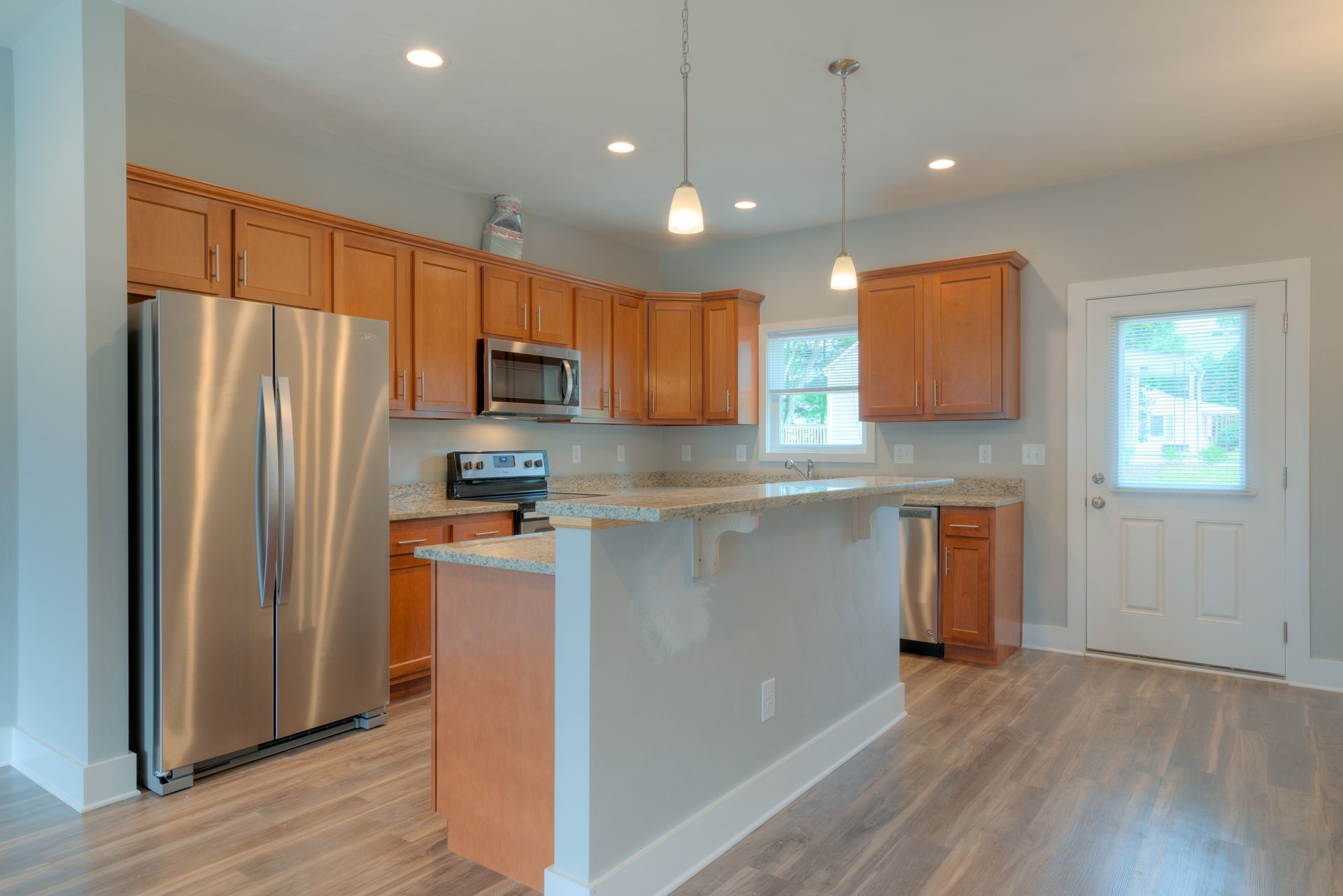Close-up of a fan palm leaf, showing green textured fronds with sunlight and shadows.