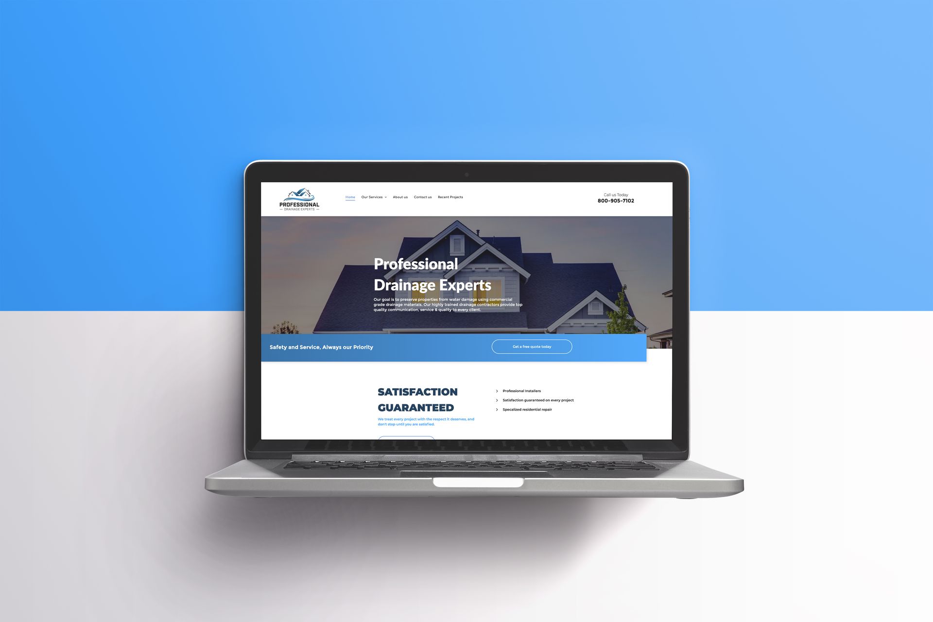 Laptop displaying a website about drainage reports, against a blue and white background.