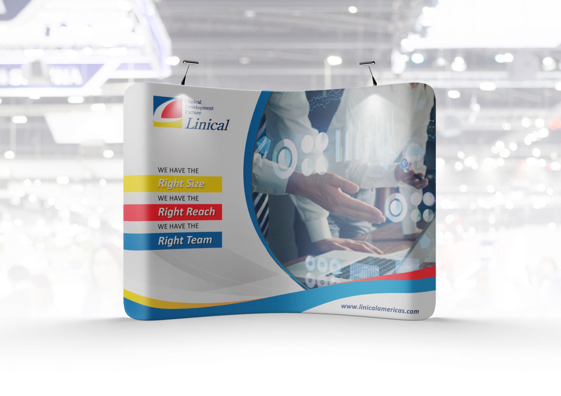 Trade show booth with company logo, graphics, and text: 