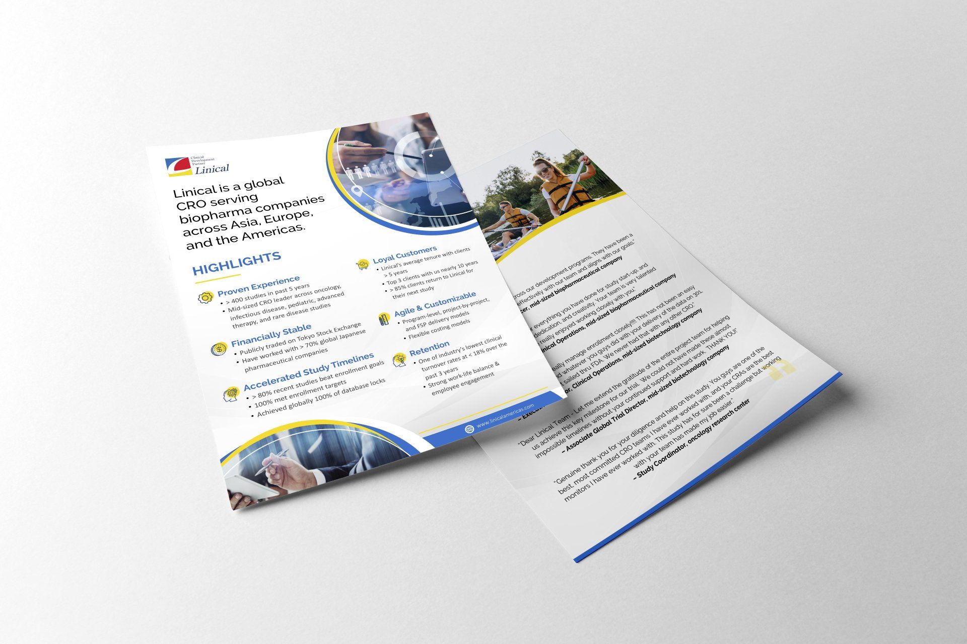 two brochures are sitting on top of each other on a white surface .