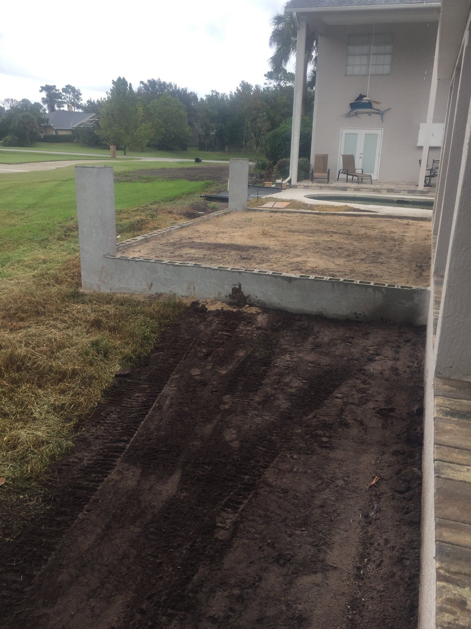 A house with a lot of dirt in front of it