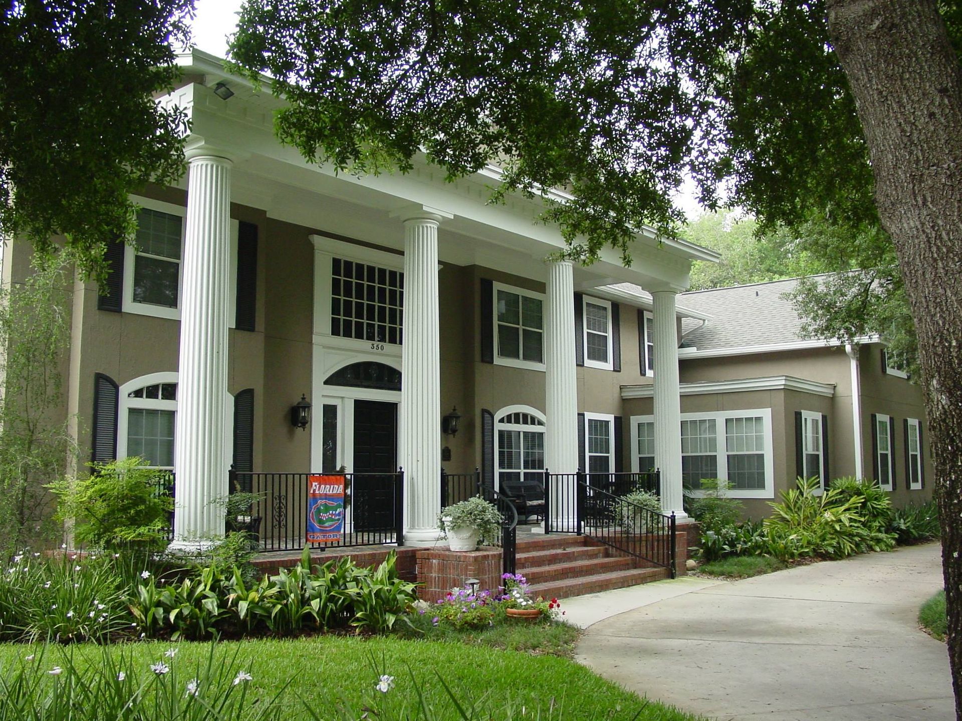 A large house with a large porch and columns