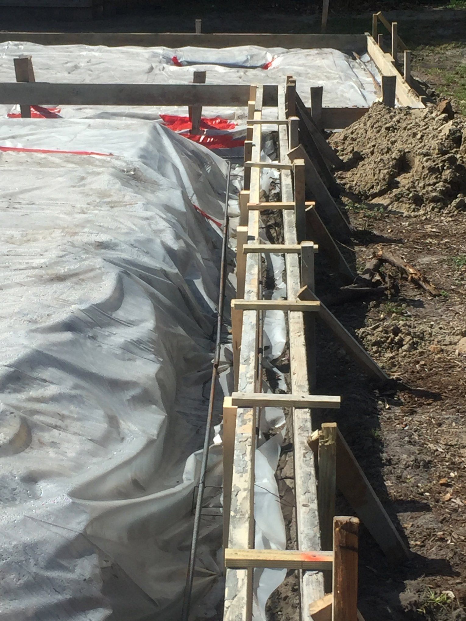 A construction site with a tarp covering the ground