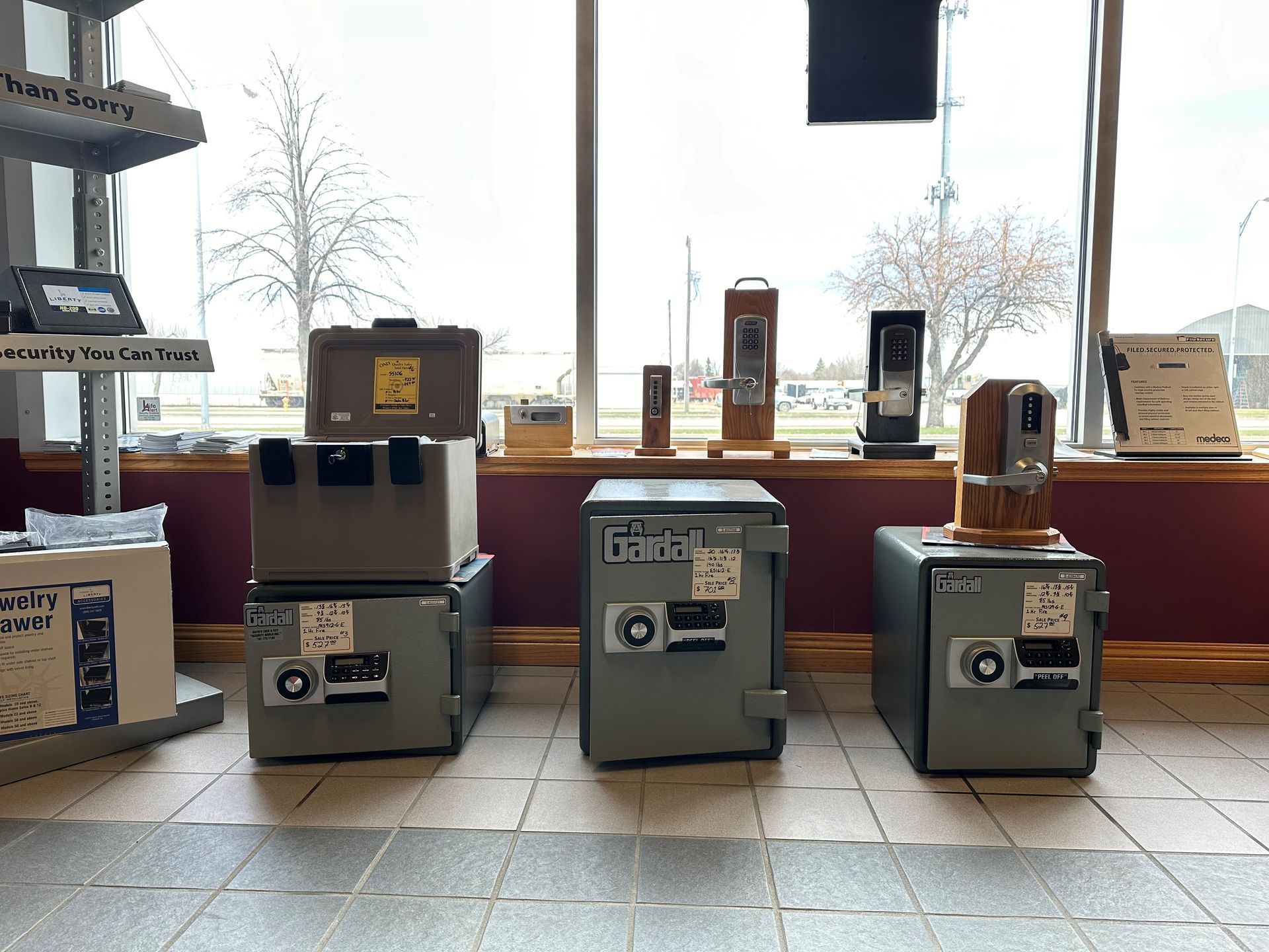 Three safes are stacked on top of each other in a room.