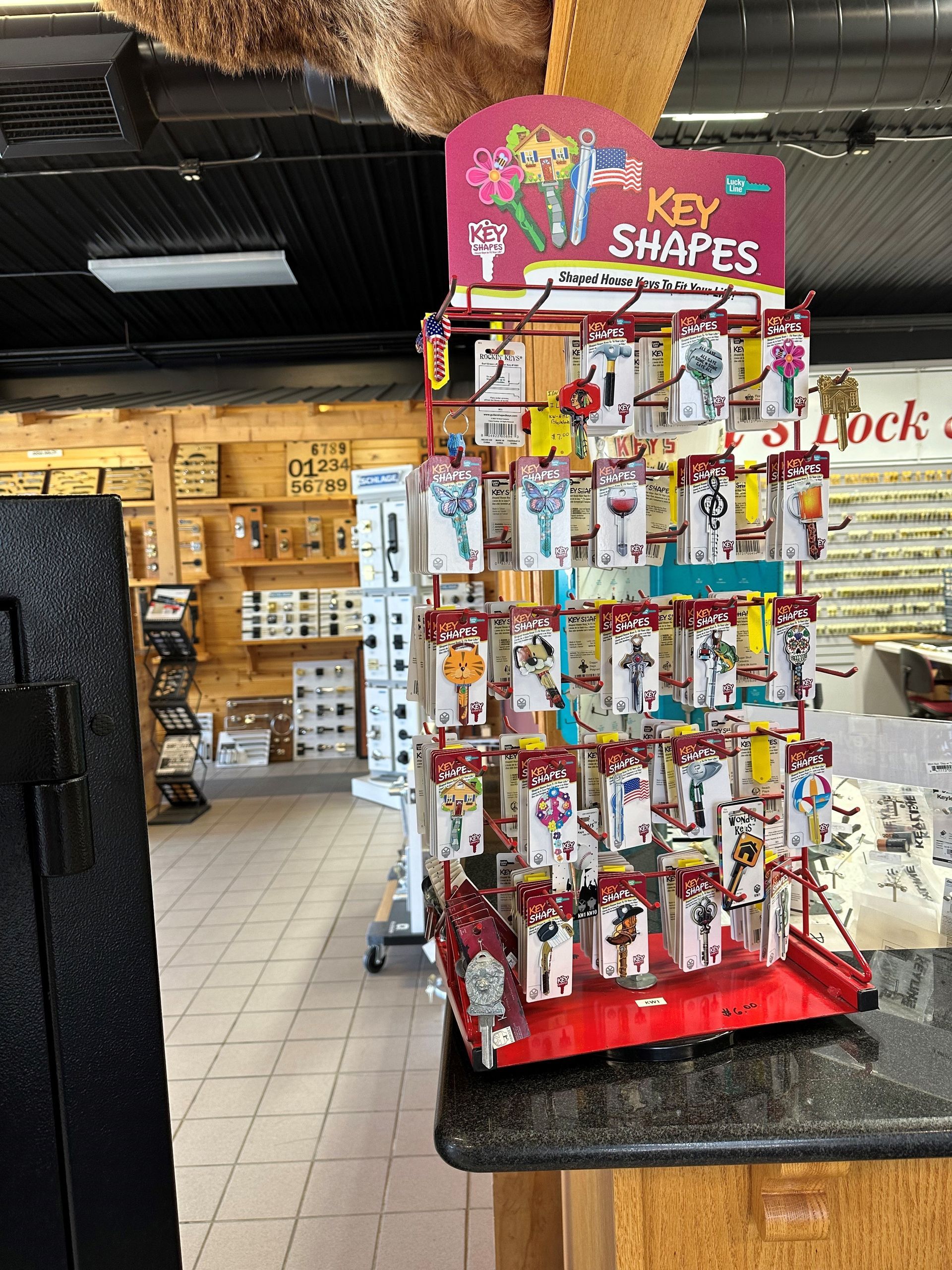 A display of key shapes is sitting on a counter in a store.
