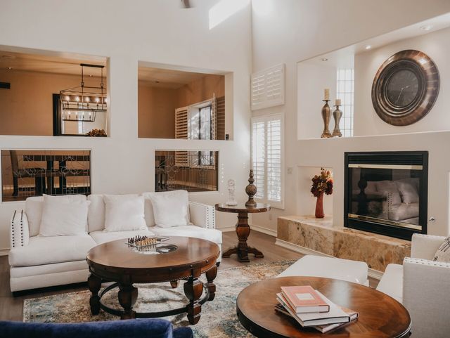 A living room filled with furniture and a fireplace.