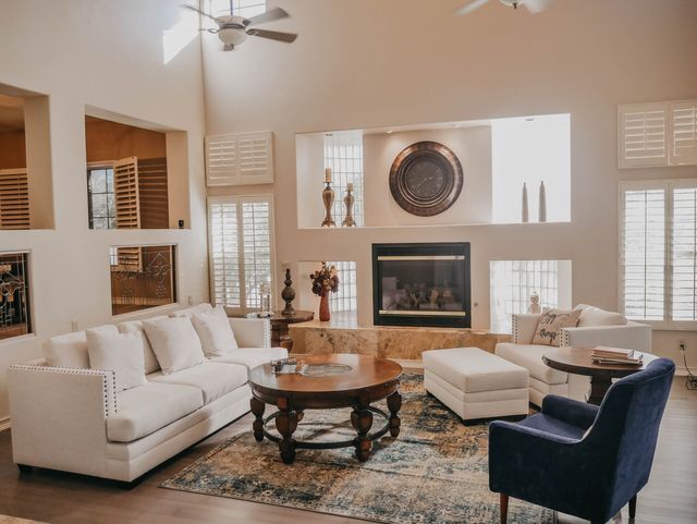 A living room filled with furniture and a fireplace.