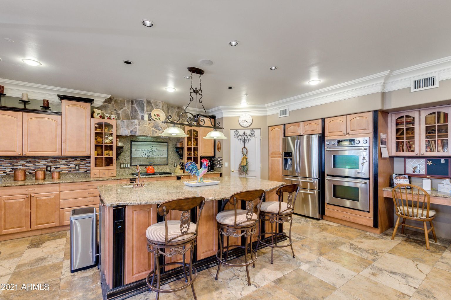 There is a large island in the middle of the kitchen.