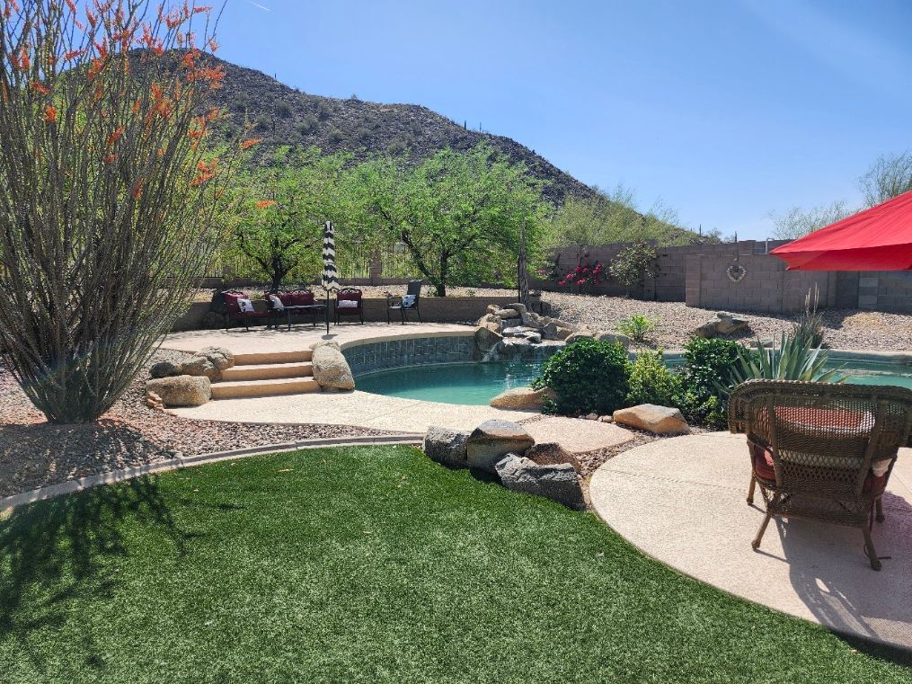 There is a fire pit in the middle of the patio.