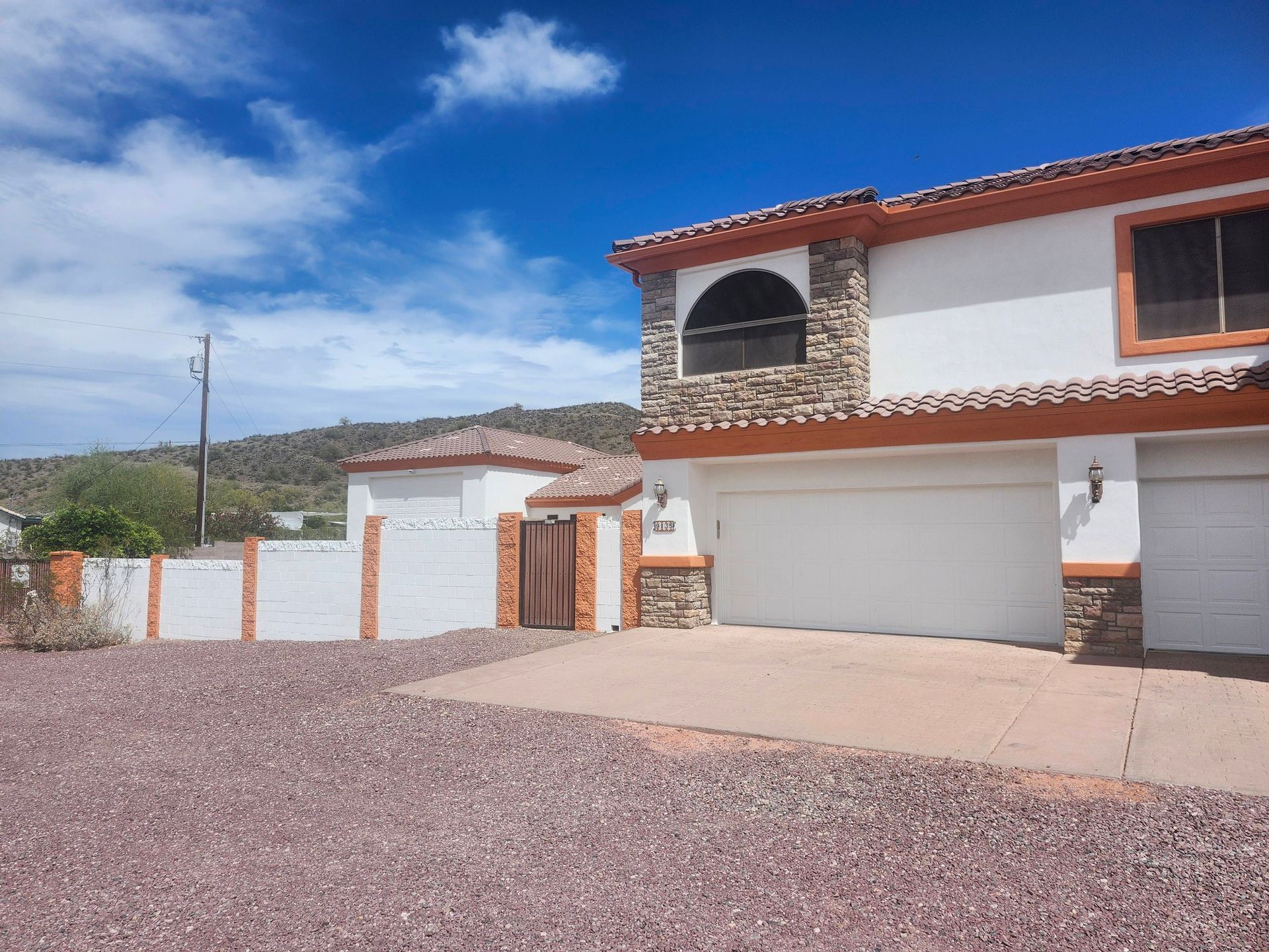A large house with a gazebo in front of it.