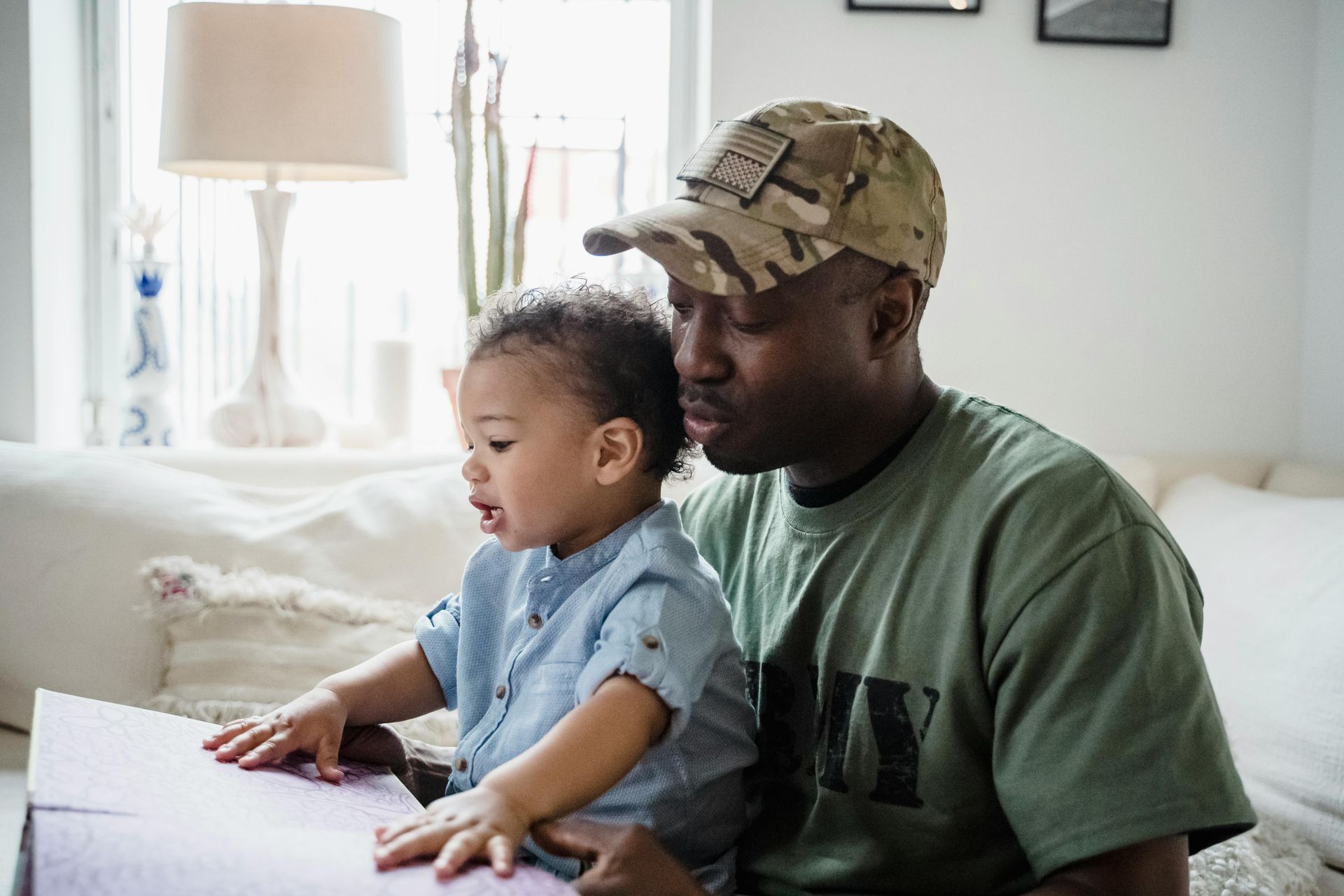 Army Veteran with child sitting on his lap