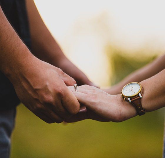 Two people holding hands