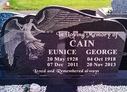 Black granite headstone with angel carving; In Loving Memory of Cain, Eunice (1928-2011) and George (1918-2013).