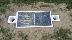 Grave marker for Mervyn George Dinsdale, with white vases, in a grassy area — Mackay Monumental Masons In Glenella, QLD
