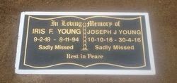 A black plaque with gold lettering,
