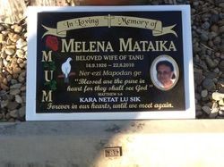 Gravestone of Melena Mataika, with text and a photo, set against rocks — Mackay Monumental Masons In Glenella, QLD