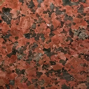 A Close Up of a Red Granite Counter Top — Mackay Monumental Masons In Glenella, QLD