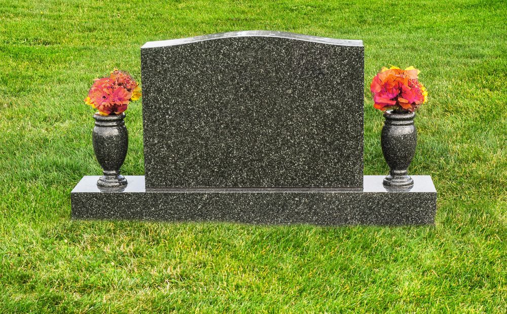 Grey Headstone With Flowers