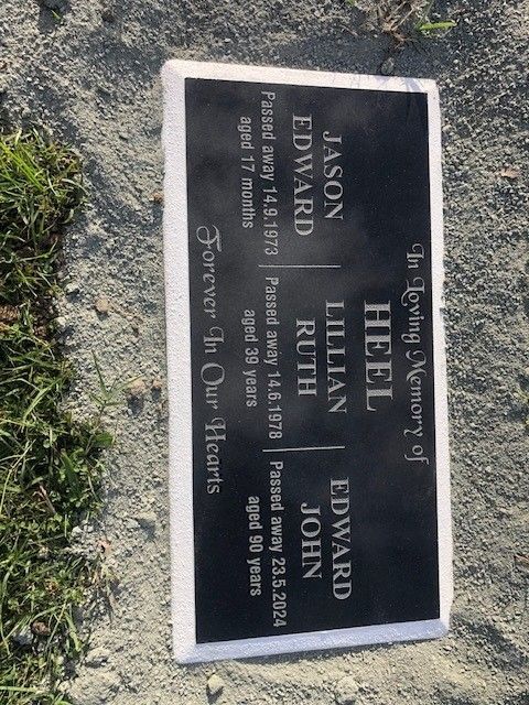 Gravestone with names: Jason Edward, Lillian Ruth, and Edward John; dates of passing and ages.