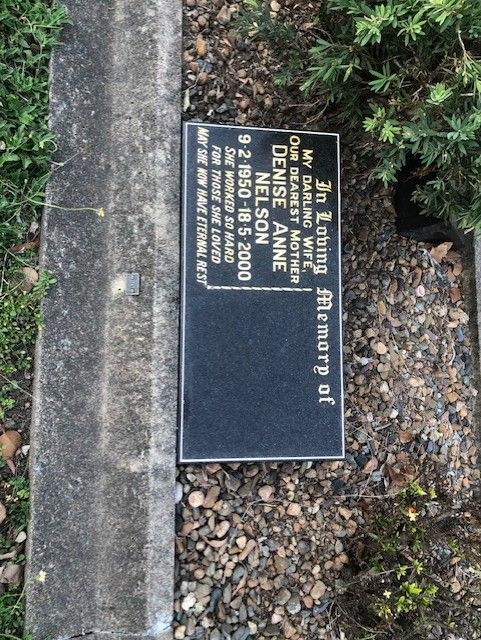 Black granite headstone with inscription, 