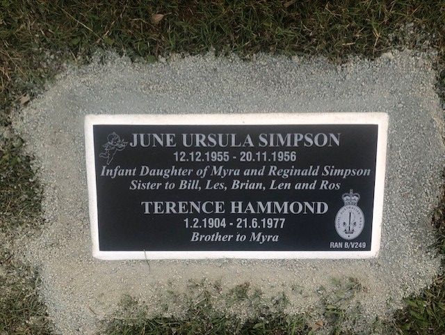 Headstone with engraved names, dates, and inscriptions of June Ursula Simpson and Terence Hammond.