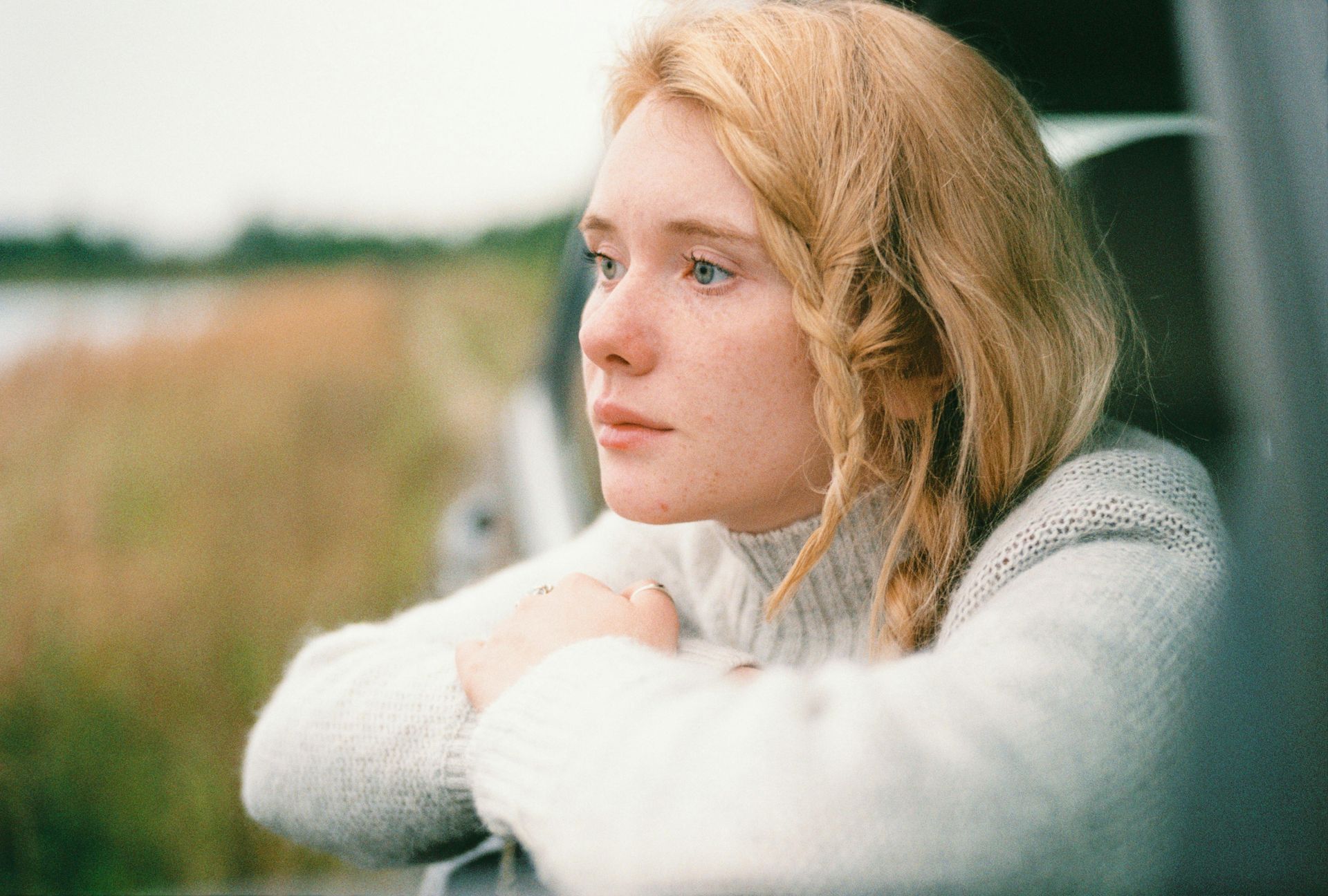 Woman looking outside of car window