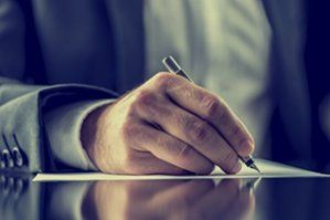 Lawyer Signing A Paper — Corporate Business Attorneys in Plant City, FL