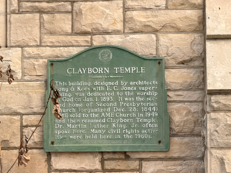Green historical marker on stone wall: Clayborn Temple.