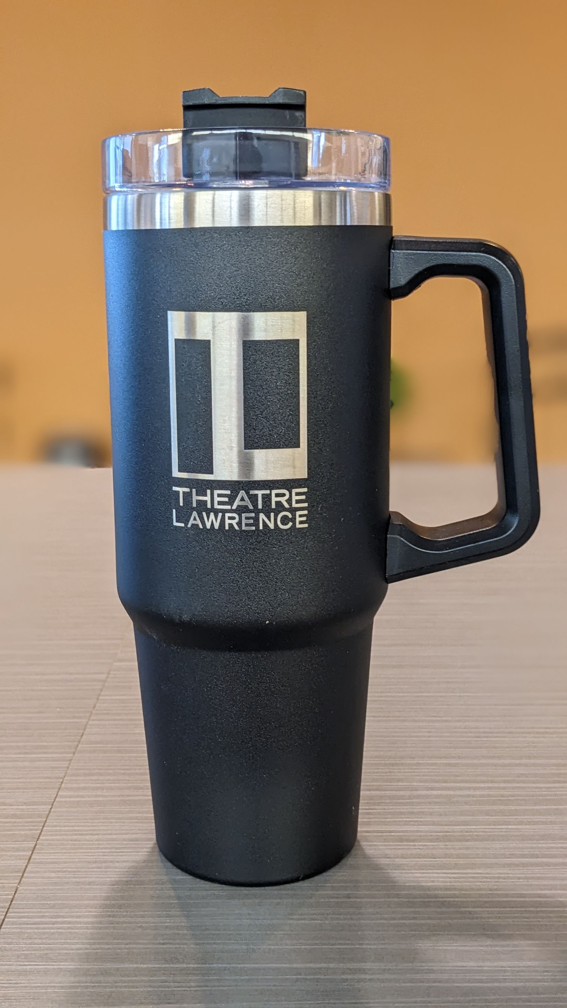 Black travel mug with a handle and 