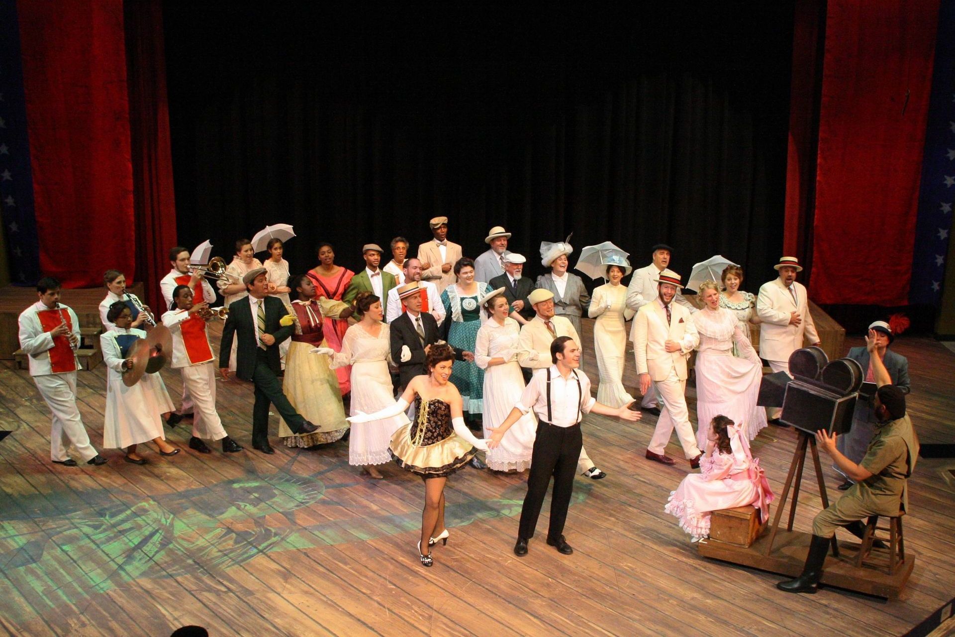 A large group of people are dancing on a stage.